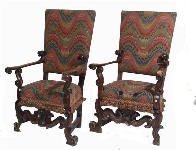 Appraisal: A PAIR OF TH CENTURY VENETIAN WALNUT ARMCHAIRS with scallop