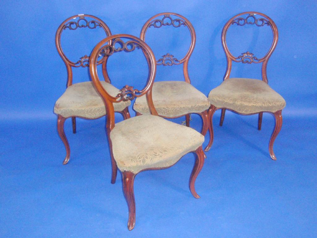 Appraisal: A set of four Victorian walnut cameo back dining chairs