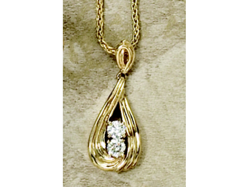 Appraisal: DIAMOND PENDANT k yellow gold fluted design pendant set with