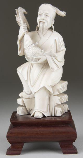 Appraisal: Japanese Carved Okimono of Seated Man With Koi the elderly