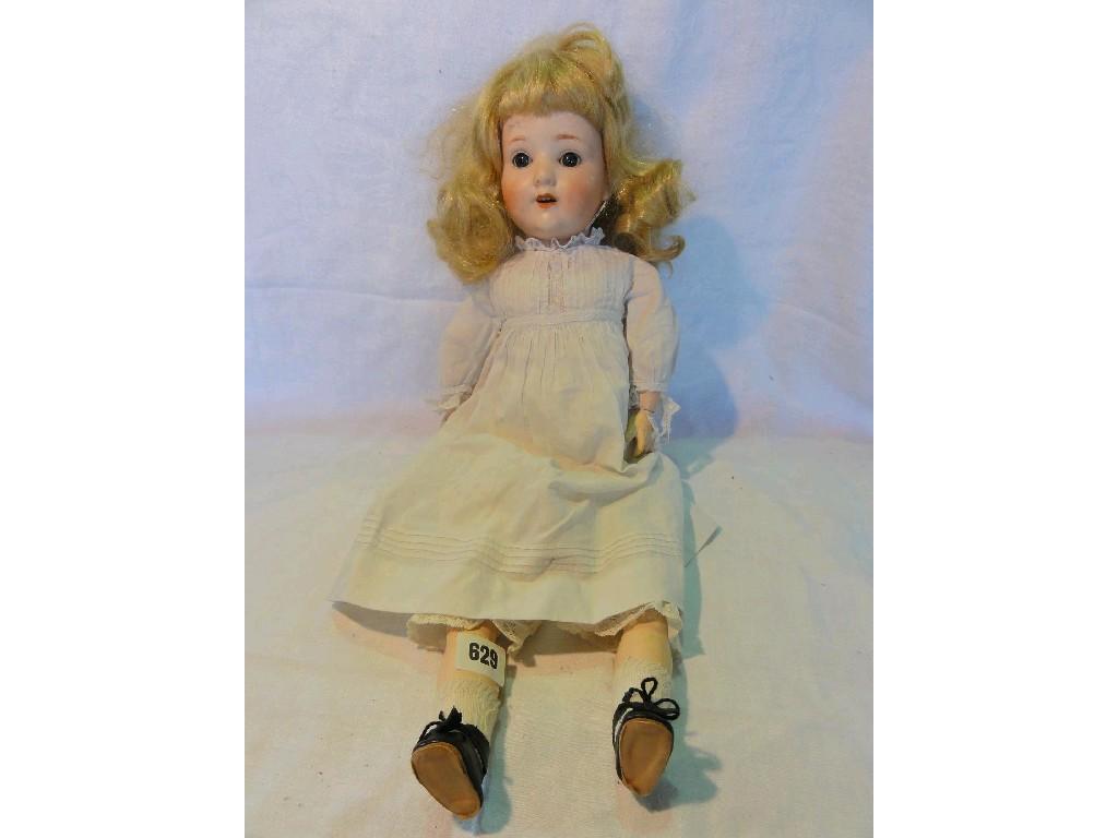 Appraisal: A doll made in Germany with a bisque head bearing