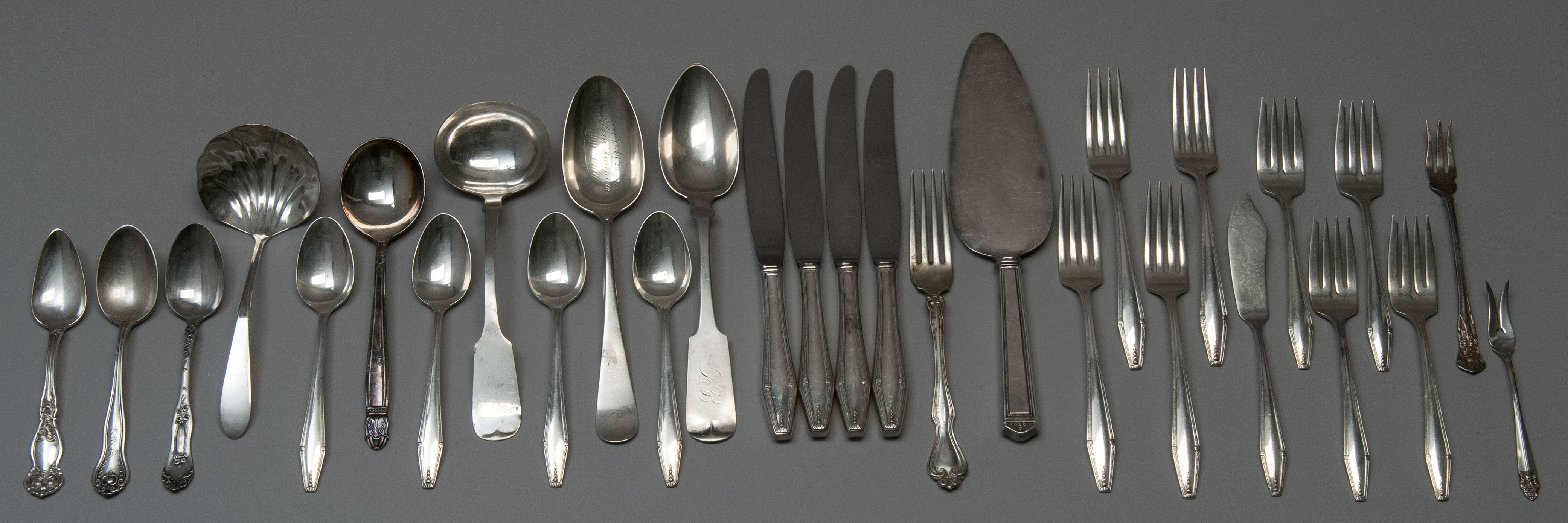 Appraisal: TWENTY-NINE PIECES OF SILVER AND SILVER PLATED FLATWARESeventeen pieces of