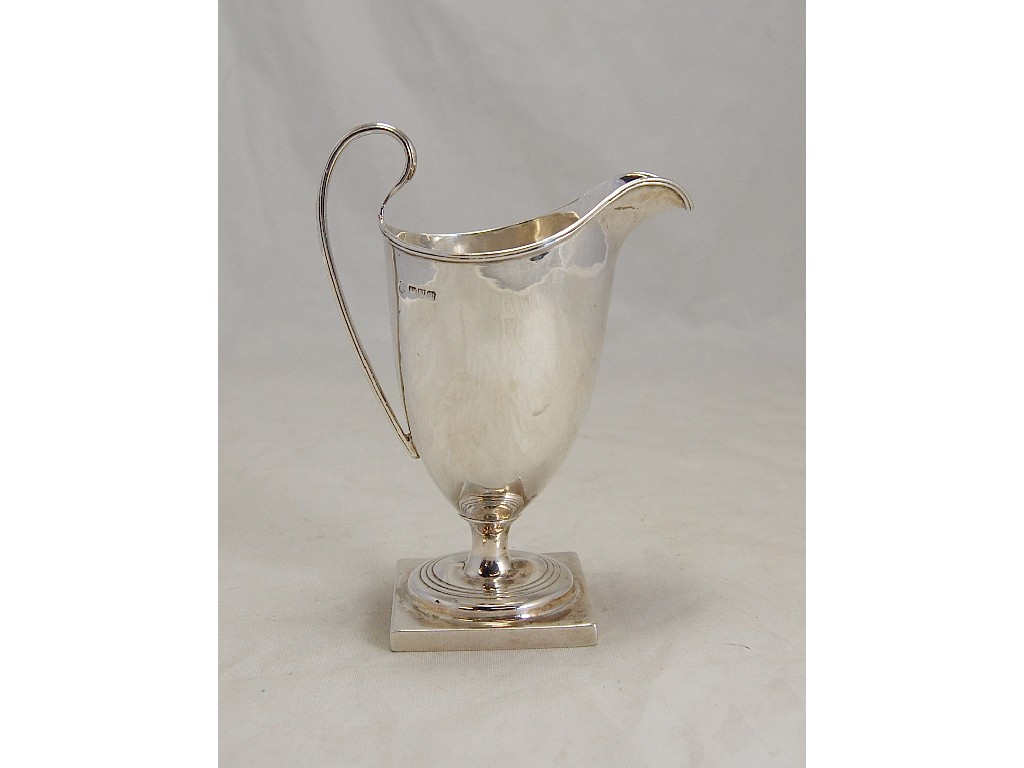 Appraisal: Silver helmet cream jug on square base with reeded handle