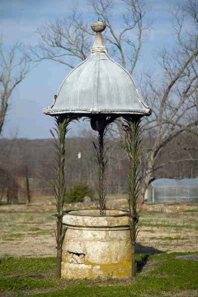 Appraisal: Italian th century Wishing Wellcast stone surround with cast iron