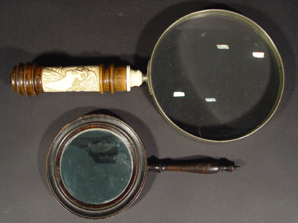 Appraisal: Large walnut and ivory handled magnifying glass carved with a