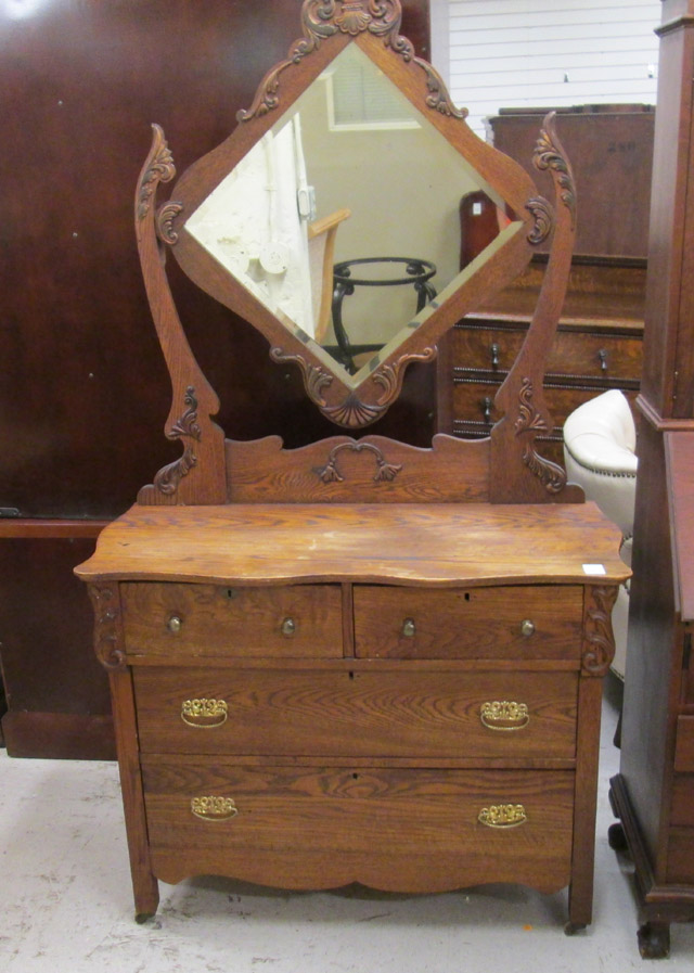 Appraisal: OAK DRESSER WITH TILT MIRROR American c a four-drawer dresser