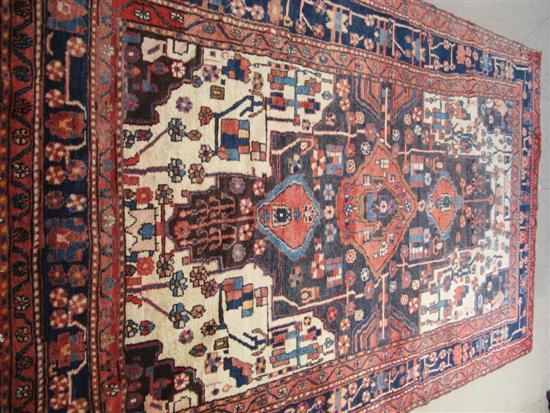 Appraisal: Hamadan rug with central latch hook medallion on a brown