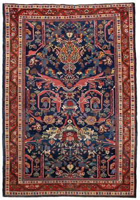 Appraisal: Persian rug central panel with winged and floral designs ft