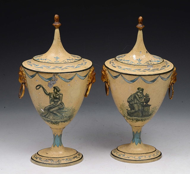 Appraisal: A PAIR OF REGENCY TOLEWARE PAINTED URNS AND COVERS each