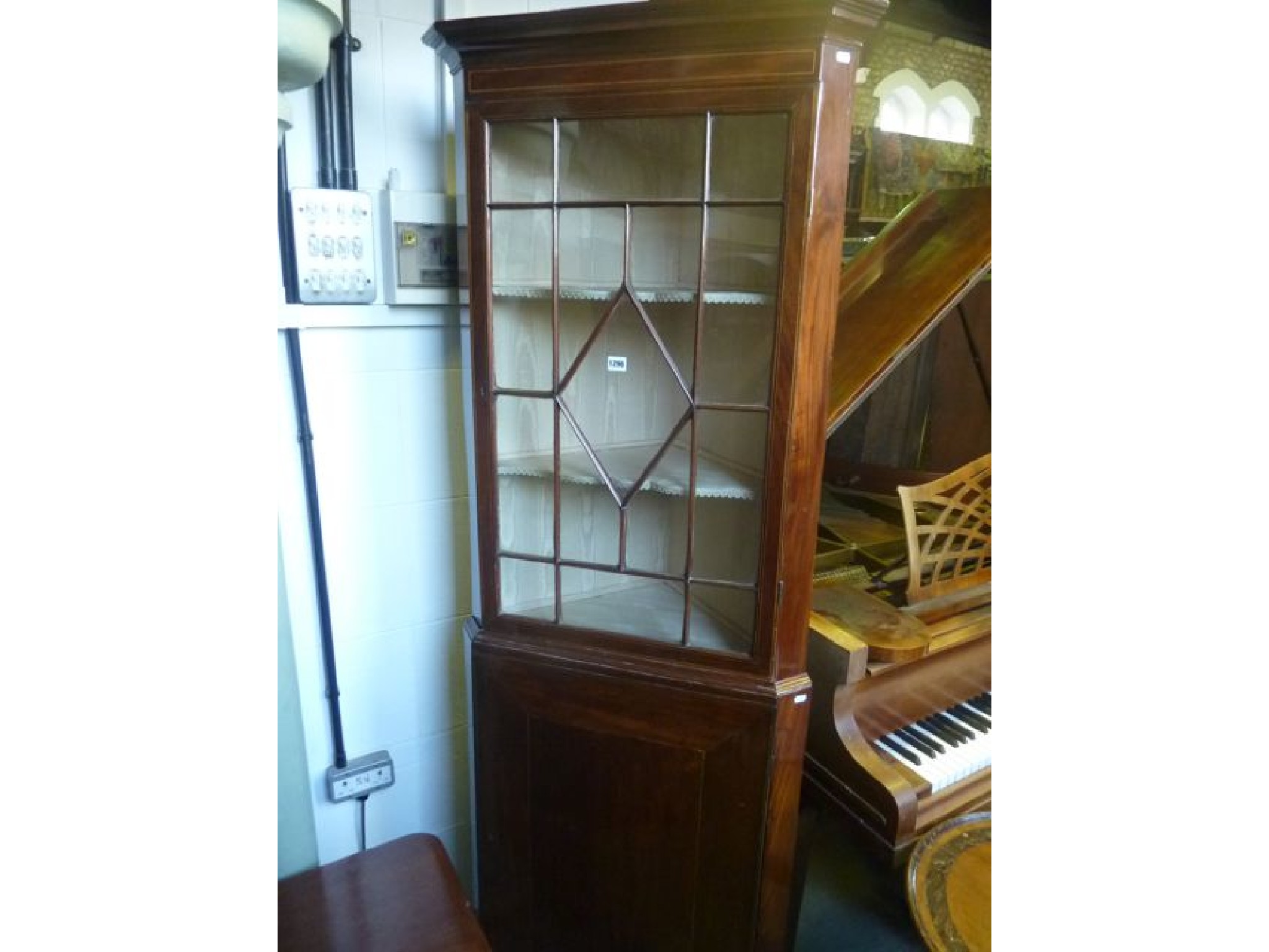 Appraisal: A th century mahogany freestanding -sectional corner cabinet enclosed by