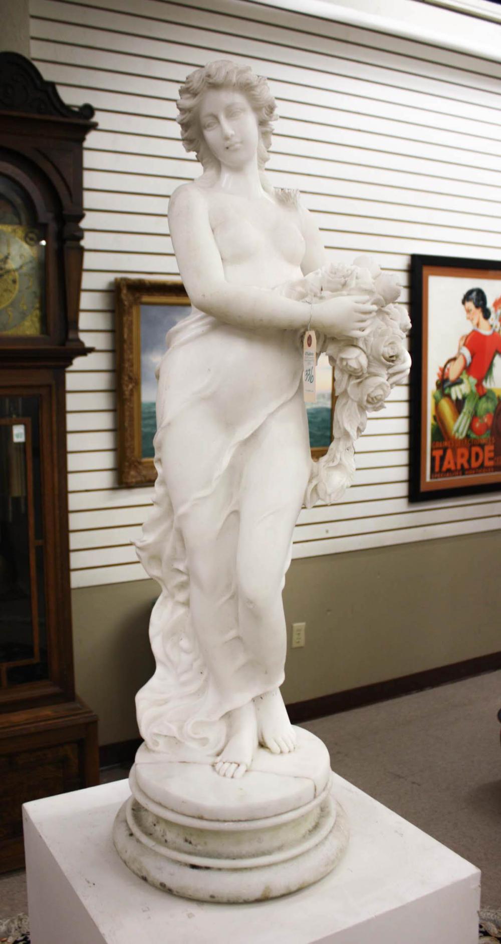 Appraisal: FIGURAL WHITE MARBLE SCULPTURE classic female figure holding roses H