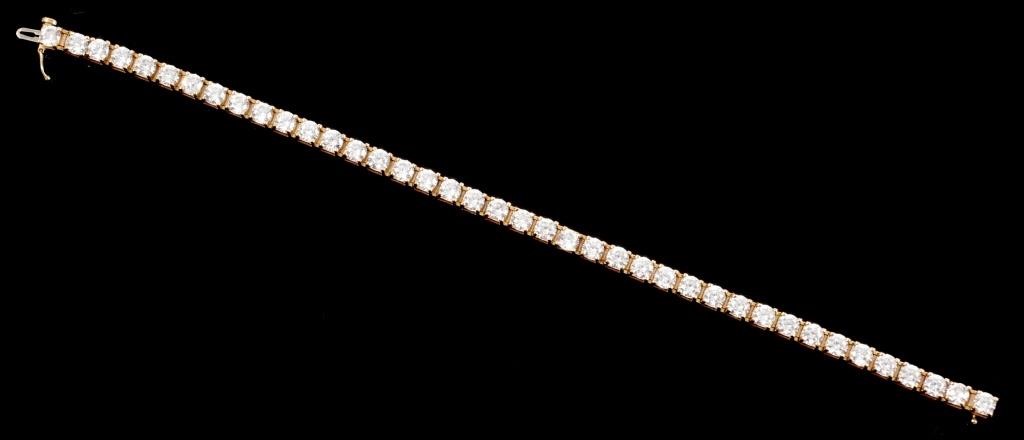 Appraisal: K yellow gold line bracelet contains round faceted white sapphires