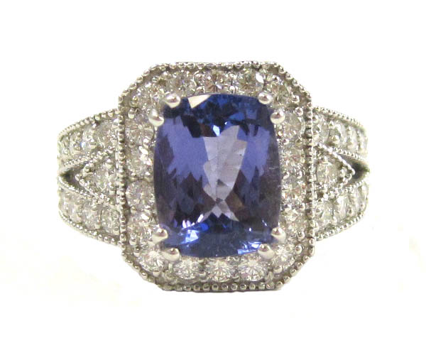 Appraisal: TANZANITE DIAMOND AND FOURTEEN KARAT GOLD RING with AIG American