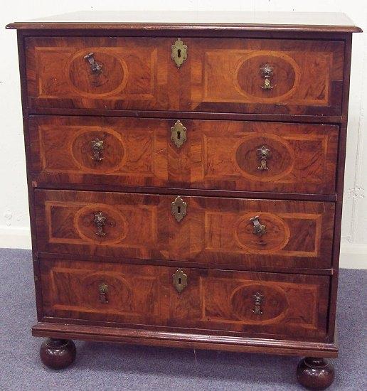 Appraisal: A walnut chest of William and Mary design with feathered