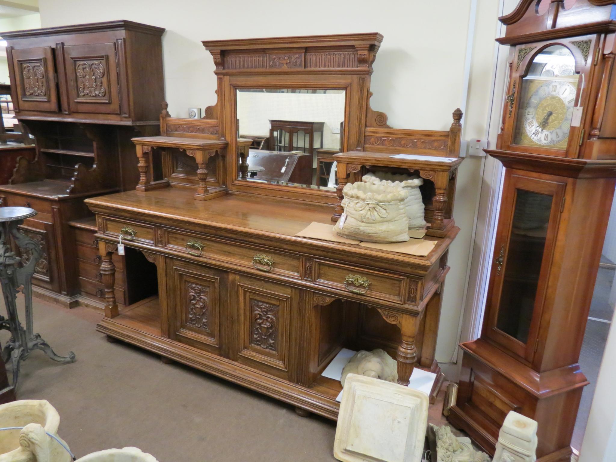 Appraisal: A large Victorian oak sideboard raised back with inset bevelled