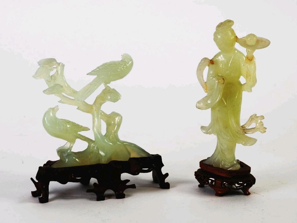 Appraisal: TWO ORIENTAL CARVED JADE ORNAMENTS one modelled as a lady