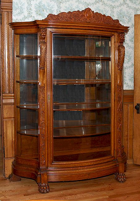 Appraisal: Lion Head Curved Oak China Cabinet Probably R J Horner