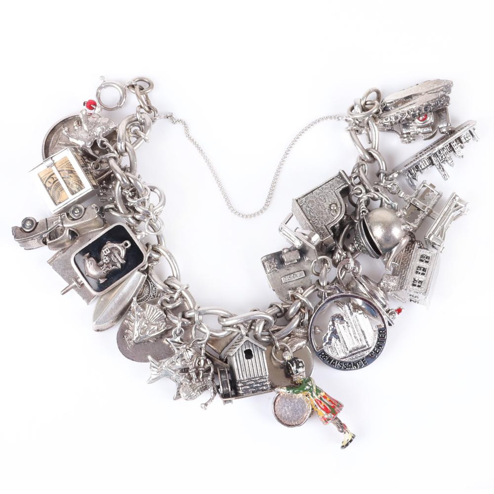 Appraisal: VINTAGE S STERLING SILVER CHARM BRACELET DRIPPING WITH DANGLING FIGURAL