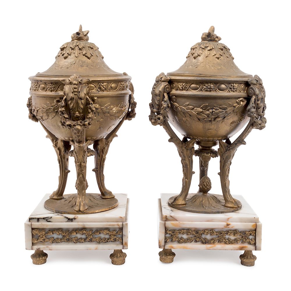 Appraisal: A Pair of Gilt Metal Urns on Onyx Bases Height