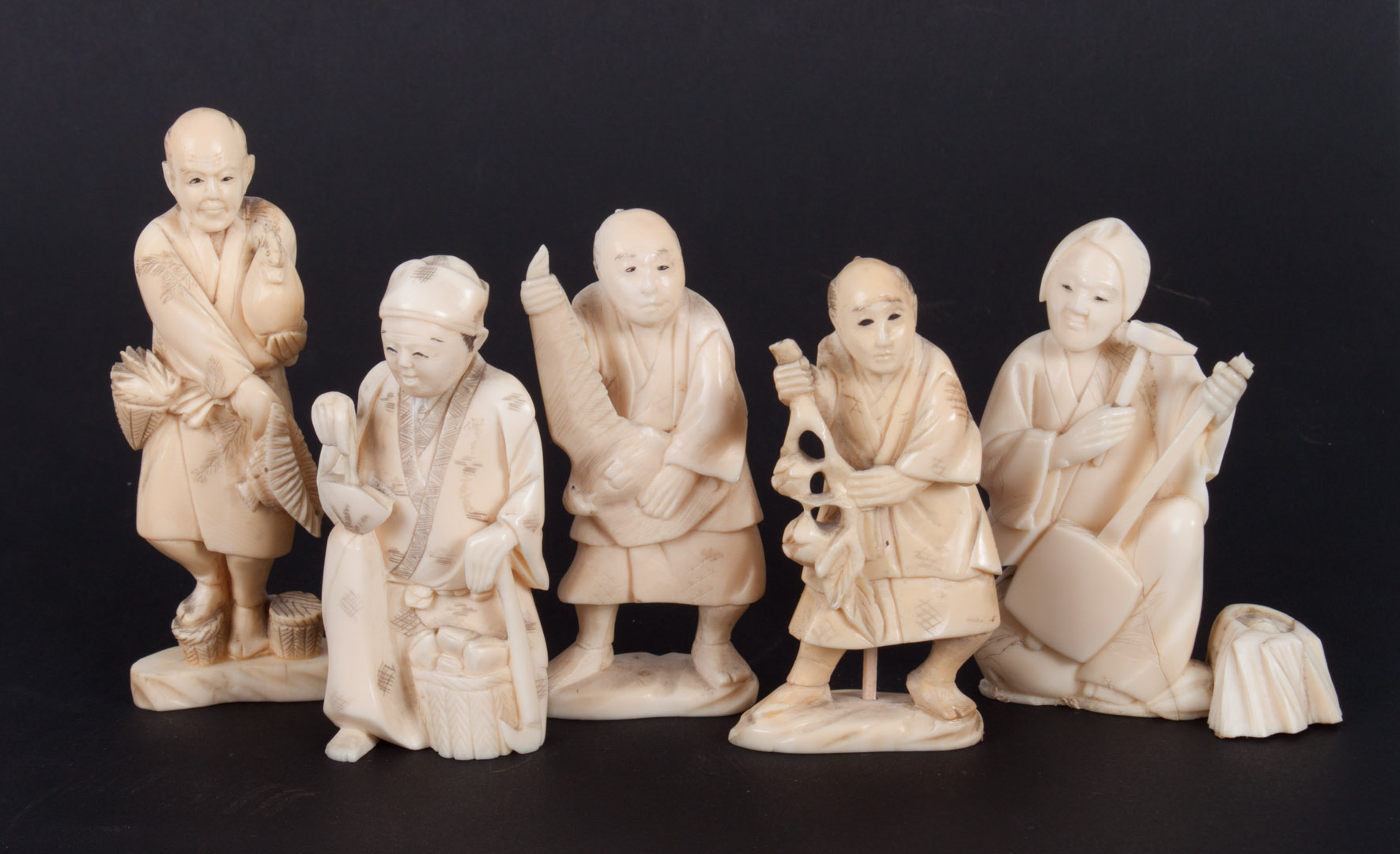 Appraisal: Five Japanese carved ivory villager figures figures include carpenter poultry