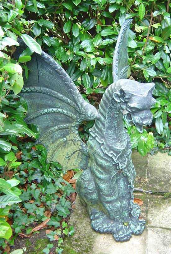 Appraisal: Pair of statues of seated dragons with outstretched wings h