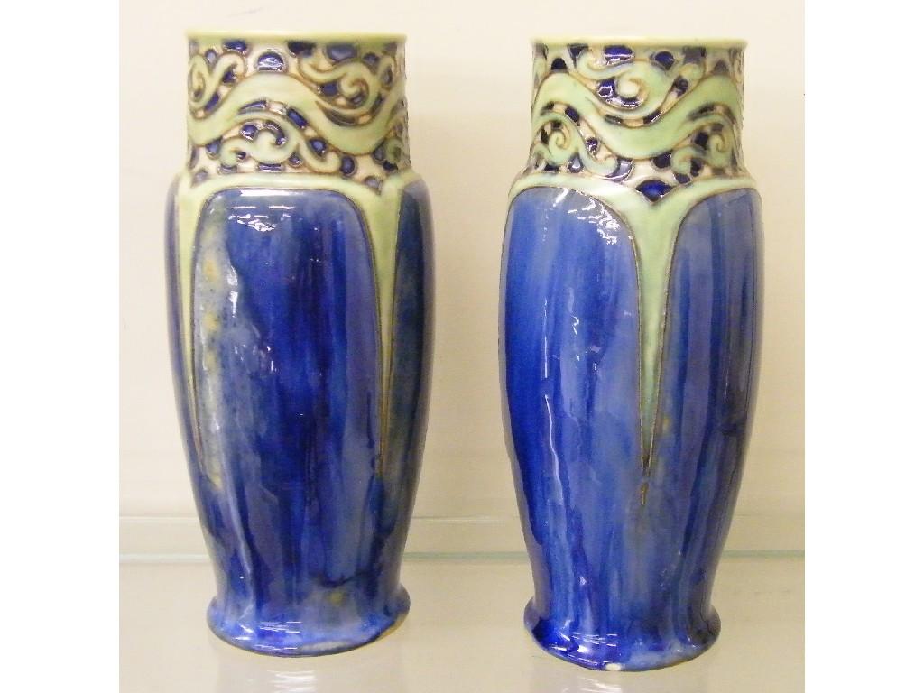 Appraisal: Pair of Royal Doulton stoneware vases the rims decorated with