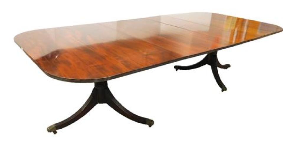 Appraisal: Sheraton style dining table mahogany double pedestal base fluted legs