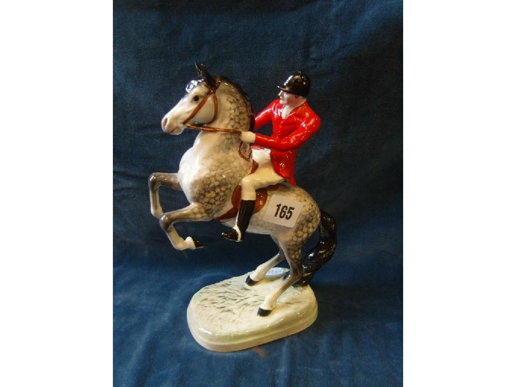 Appraisal: A Beswick model of a rearing horse with red jacketed