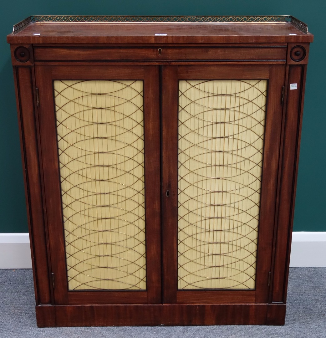 Appraisal: A Regency mahogany side cabinet the brass galleried top over