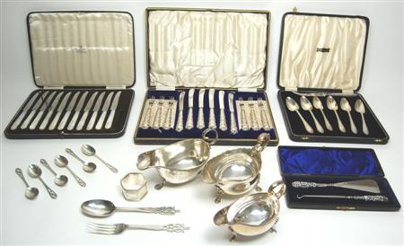 Appraisal: A collection of silver to include three sauceboats cased knives