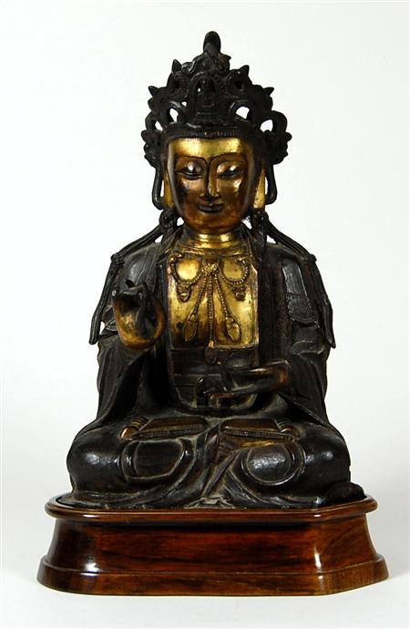 Appraisal: A Chinese bronze and gilt bronze Buddha Qing Dynasty seated