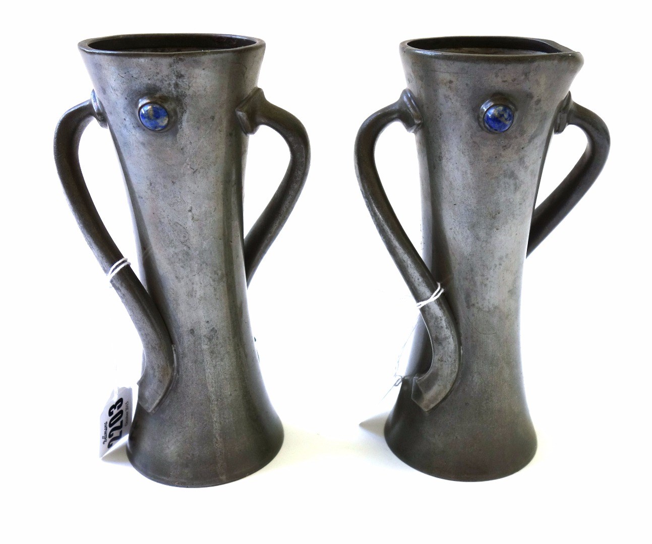 Appraisal: A pair of Tudric pewter Art Nouveau vases each with