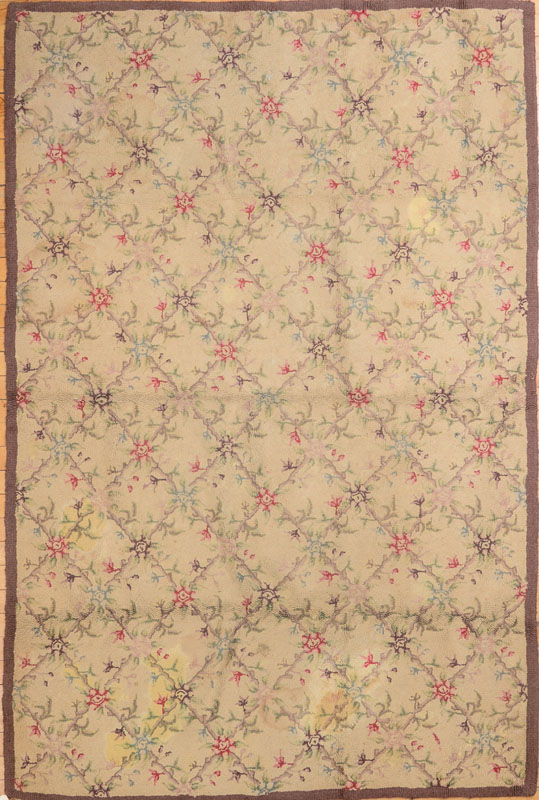 Appraisal: ENGLISH FLORAL HOOKED RUG With a cream ground ft in