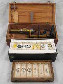 Appraisal: A boxed microscope together with a large quantity of biological