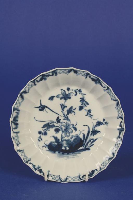 Appraisal: A FIRST PERIOD WORCESTER BLUE AND WHITE FACETED PLATE circa