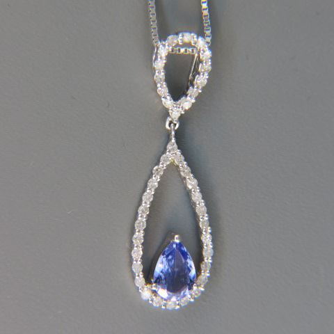 Appraisal: Tanzanite Diamond Pendant carat pear shape gem surrounded by diamonds