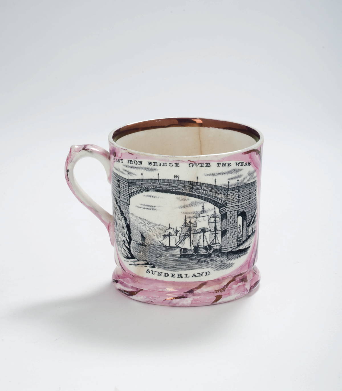 Appraisal: NEWCASTLE PINK-PURPLE LUSTRE AND BLACK TRANSFER-PRINTED MUG MALING CO CIRCA