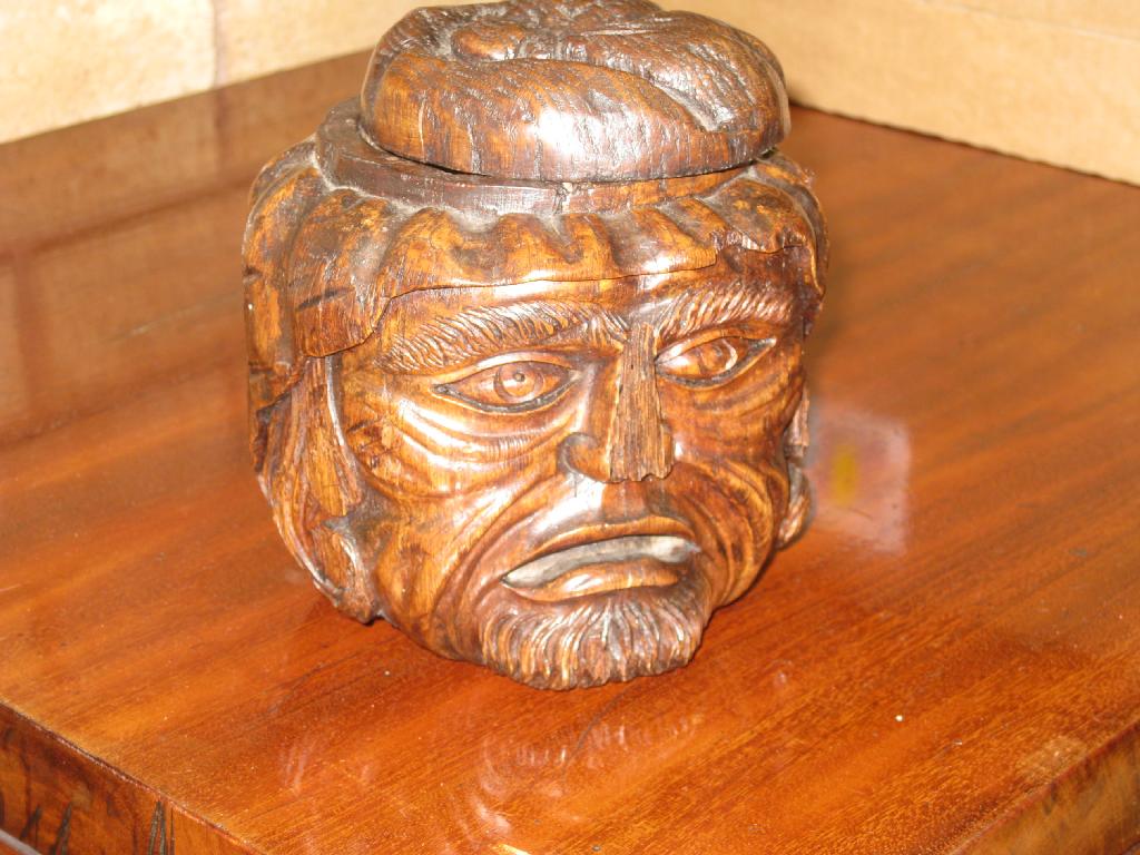 Appraisal: A carved oak mask Tobacco Jar and Cover