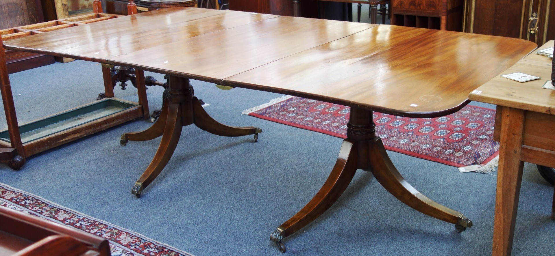 Appraisal: An th century and later mahogany twin pillar extending dining