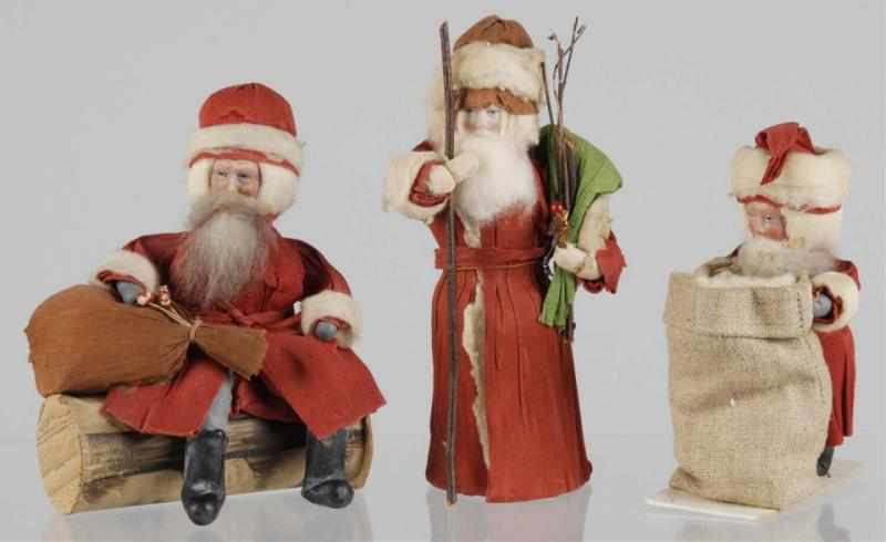 Appraisal: Lot of Santas Description Includes one candy container with composition