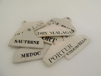 Appraisal: Eight various glazed pottery porcelain bin labels CALCAVELLA PALE BRANDY