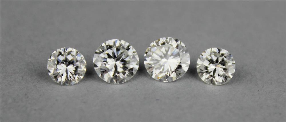 Appraisal: FOUR UNMOUNTED DIAMONDS the larger two diamonds are round brilliant