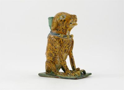 Appraisal: A continental faience model of a seated dog decorated cm