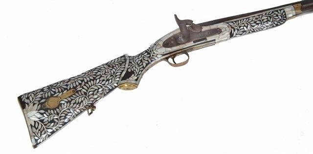 Appraisal: AN INDIAN GUJARATI RIFLE with profusely mother of pearl inlaid