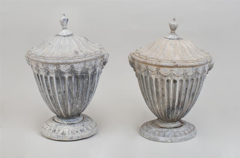 Appraisal: PAIR OF NEOCLASSICAL STYLE LEAD COVERED URNS AND COVERS x