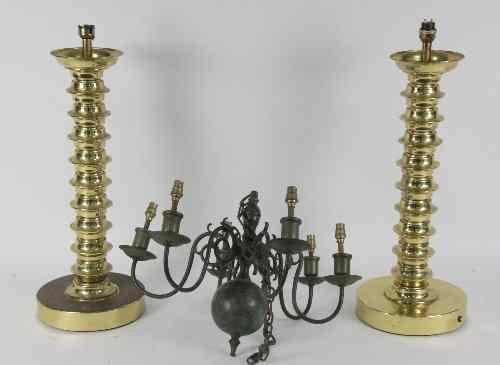 Appraisal: A pair of Sarach brass lamps the columns reel turned