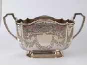 Appraisal: A late Victorian silver sugar bowl rectangular with incurved corners