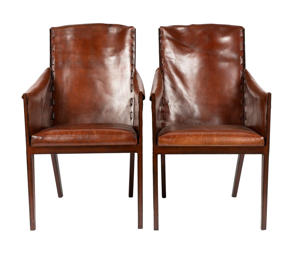 Appraisal: A PAIR OF LEATHER PAINTED IRON ARMCHAIRSunsigned in the style