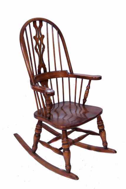 Appraisal: A POSSIBLY YEW WOOD WINDSOR ROCKING CHAIR with pierced splat