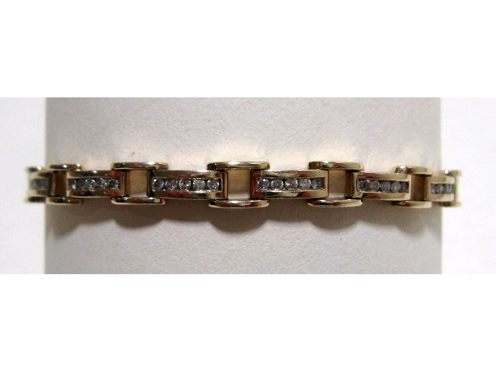 Appraisal: Nine carat gold channel set diamond line bracelet with total